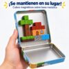 Figuras construidas con bloques magnéticos adheridas firmemente a la tapa de la caja metálica sin caerse