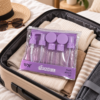 kit de viaje morado en maleta
